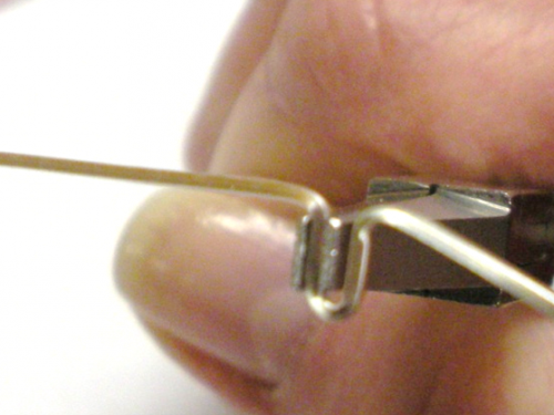 Judy Larson's Adding Loops for Dangles on a Classic Wire Bezel Wrap - , Classic Wire Jewelry, Wire Wrapping, Wrapping, Wire Wrapping Jewelry, Reposition the pliers and bend the other side at a 90°